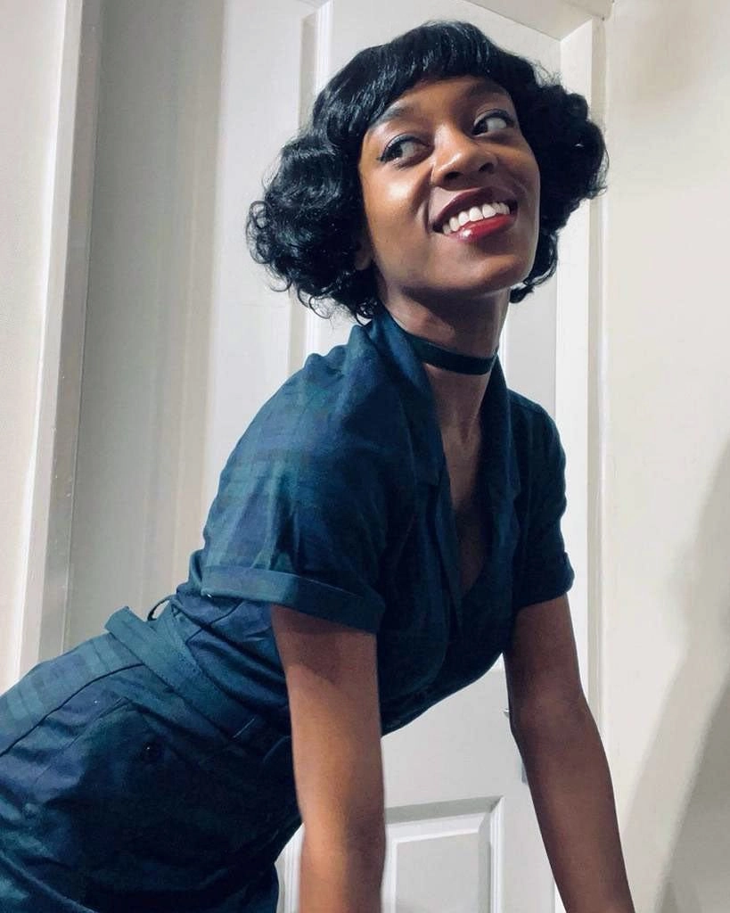 A short black vintage style wig with finger waves: Marlene