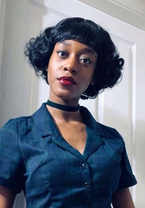 A short black vintage style wig with finger waves: Marlene