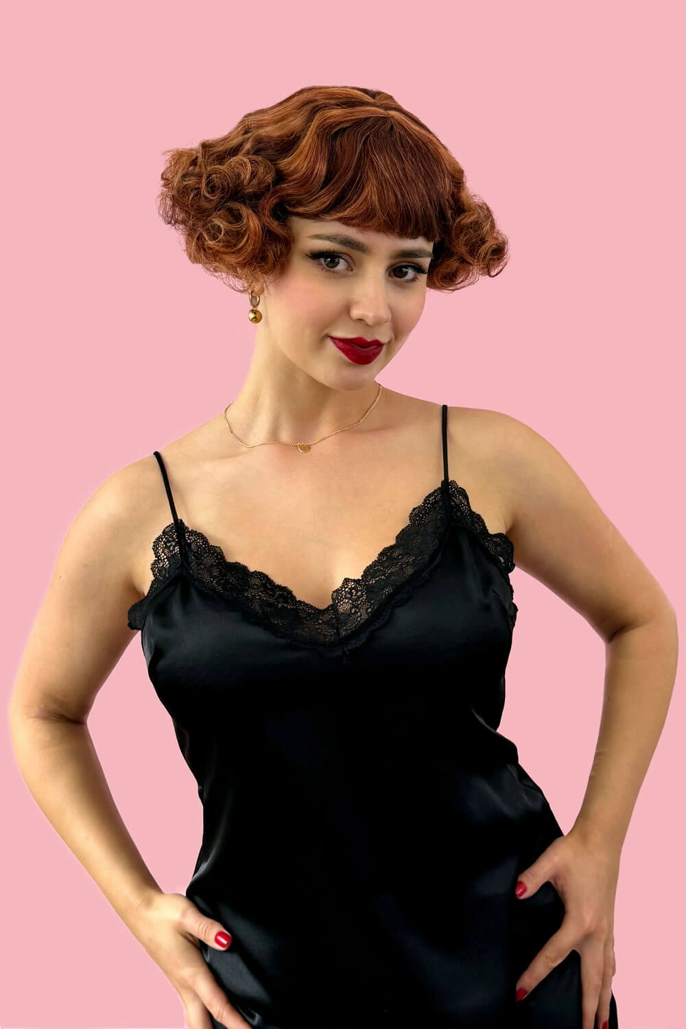 A short red, auburn and blonde mix vintage style wig with waves: Solana