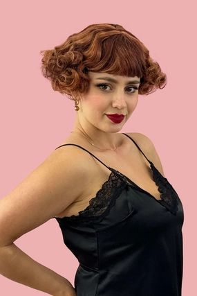 A short red, auburn and blonde mix vintage style wig with waves: Solana