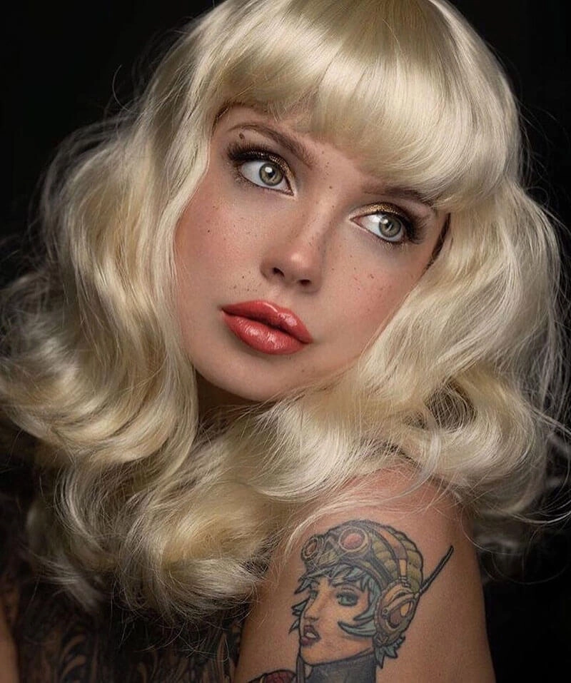 Blonde pinup wig, curled with short fringe, 1950s style: Cora