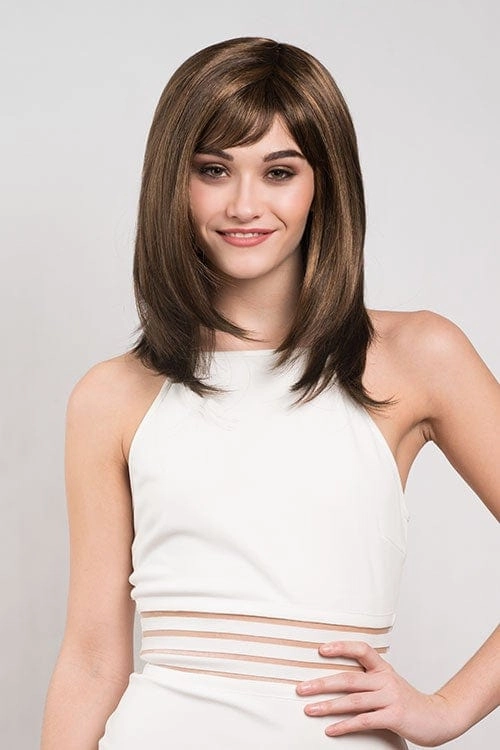 Chocolate brown wig with blonde highlights, face frame style: Katie