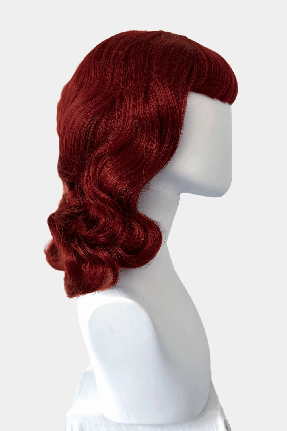 Copper red 1950s pinup wig, curled with short fringe: Kitty