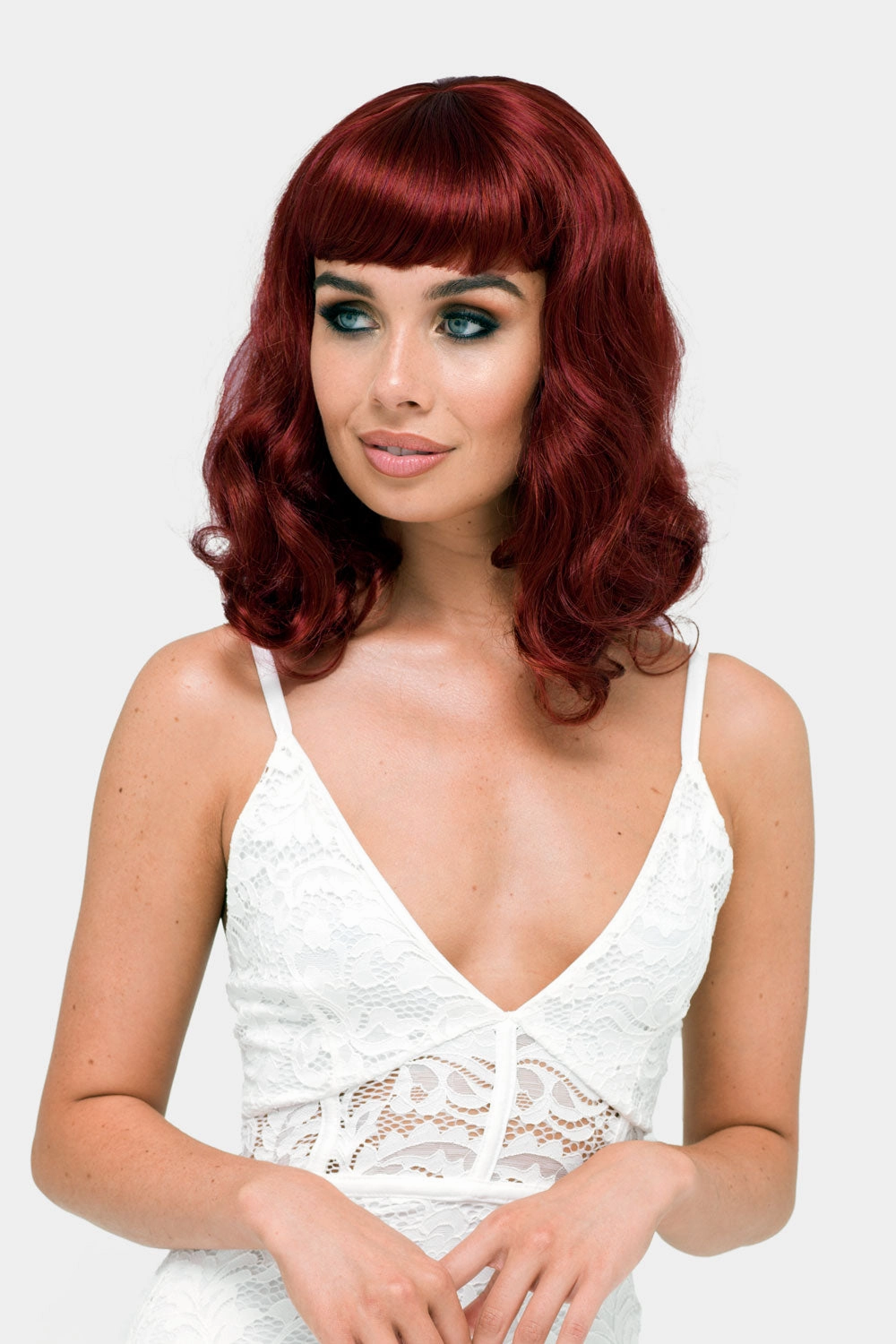 Copper red 1950s pinup wig, curled with short fringe: Kitty