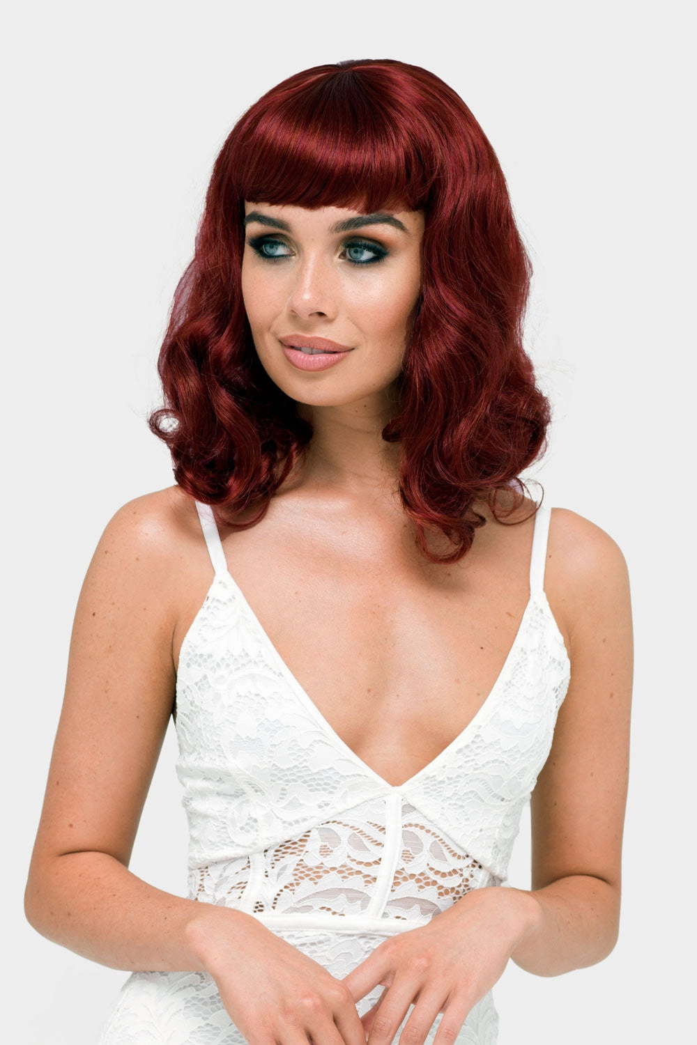 Copper red 1950s pinup wig, curled with short fringe: Kitty