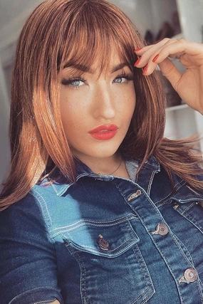 Gingery auburn wig with blonde highlights face frame style: Geri