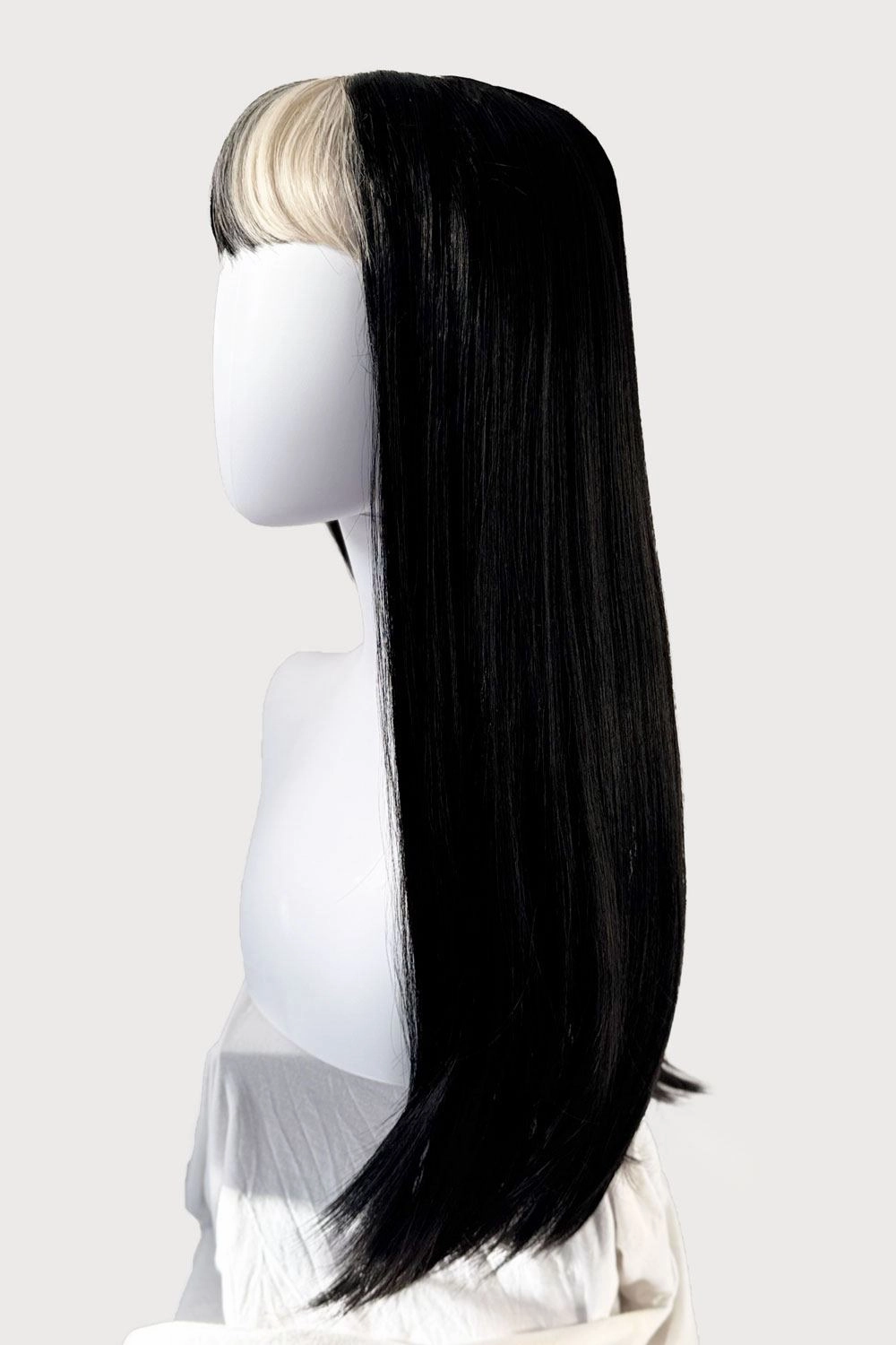 Long, black, straight wig with platinum fringe streak and retro, straight fringe: Imogen