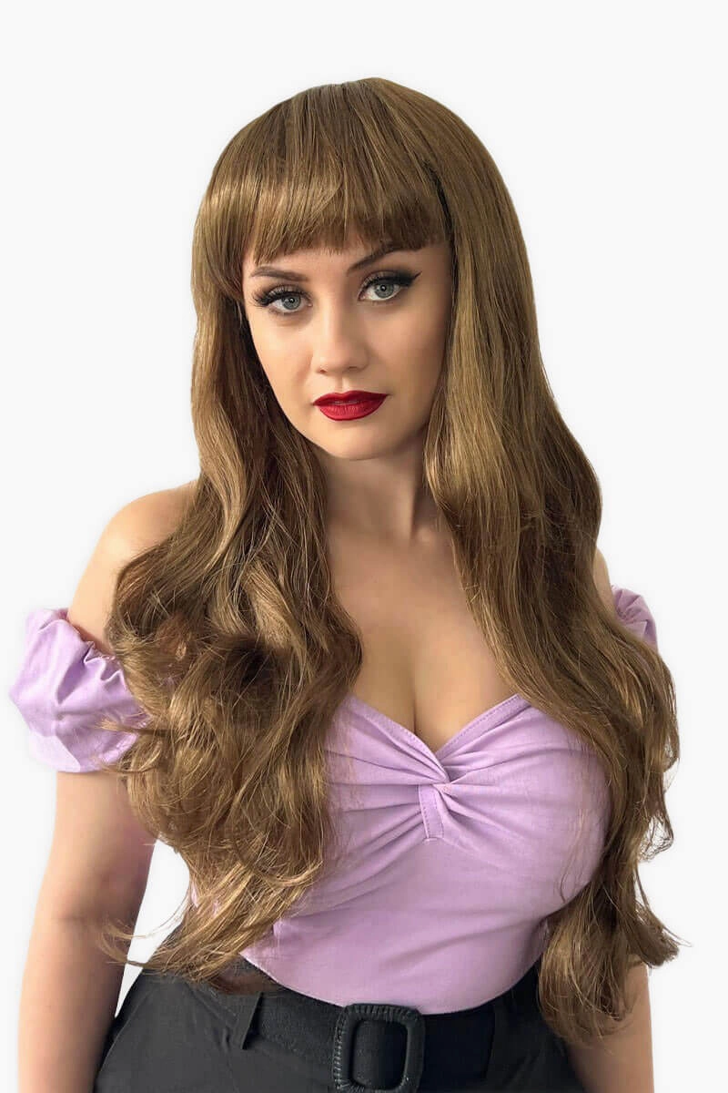 Long wavy light brown wig with vintage-style straight fringe: Maya