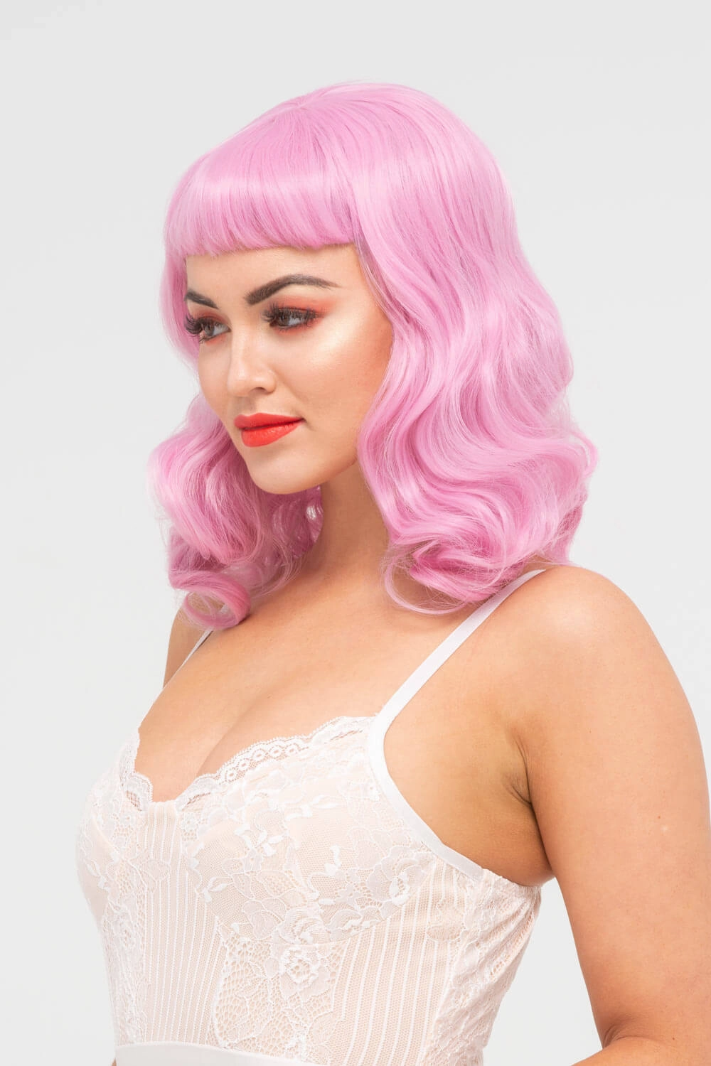 Pink pinup style wig, with finger waves and a short fringe, 1950s style: Stevie