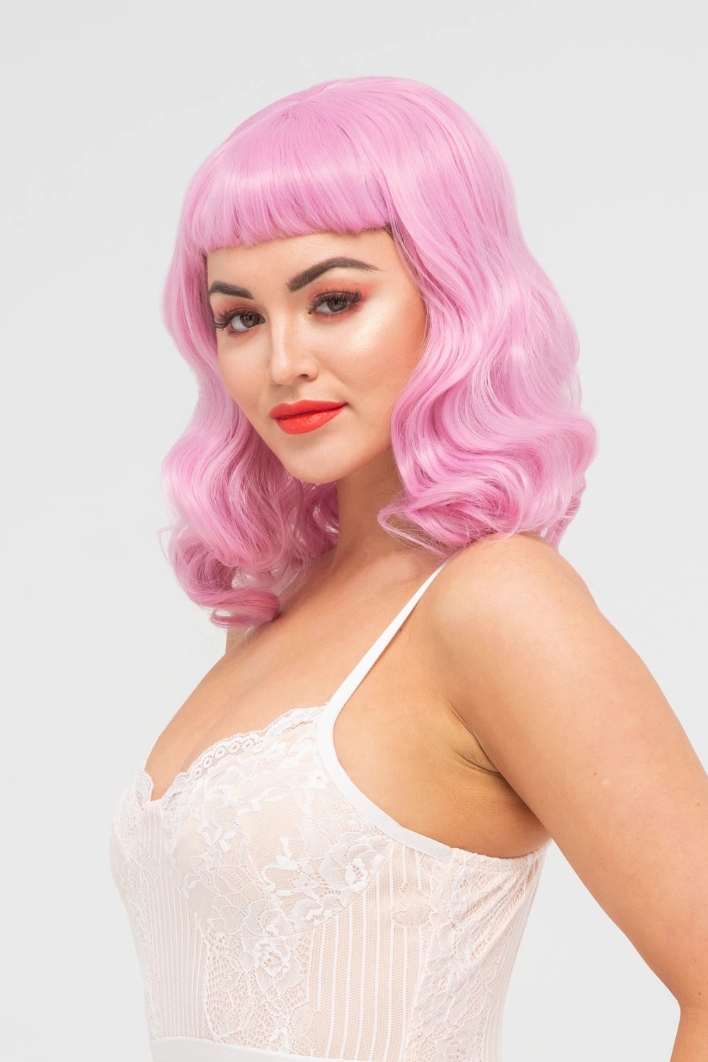 Pink pinup style wig, with finger waves and a short fringe, 1950s style: Stevie